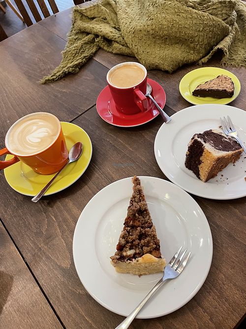 Plum cake with walnut topping, marble cake, a fudge cookie with nuts, and two coffees with soy milk!  at Torten Schmiede in Bayreuth