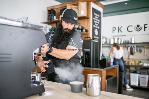 Head of Coffee, Brett Ramus, steaming milk for a latte.  Alternative milks include oat milk and house-made almond. at PK Coffee in Stowe