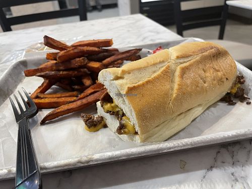 Philly cheesesteak with sweet potato fries💗 at Brick City Vegan in Newark