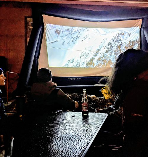 Movie night in the courtyard area where the food truck is located at 1874 Food Truck in Del Norte