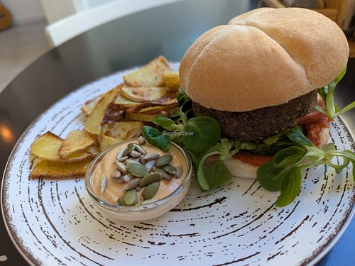 Burger and fried potatoes at REVIV in Malaga