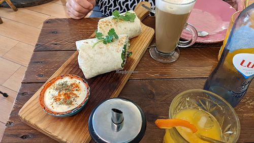 Wife's vegan burrito and almond milk latte... She approves 😁 at Break Sé in Lisbon