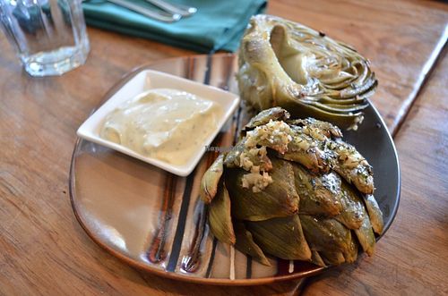 super delicious Roasted Artichoke  - Roasted globe artichoke served with a vegan garlic & lemon aioli at Julia's Vegetarian Restaurant in Pacific Grove