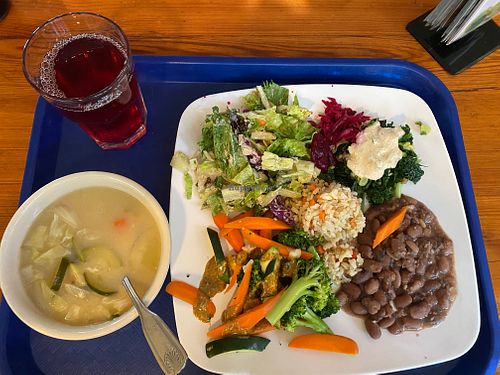 Lunch on Nov 2, 2023: Miso soup, garden greens, rice, pinto beans, mixed veggies, kale and pickled beets. Also hibiscus tea at Casa de Luz in Austin