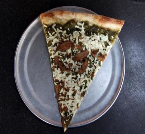 no conditions: daiya mozzarella, creamy basil cashew spread and soy curls on whole wheat crust. at Sizzle Pie - E Burnside in Portland