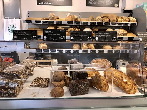 4 vegan treats and in the back fresh organic bread at Bio Kleiweg in Rotterdam