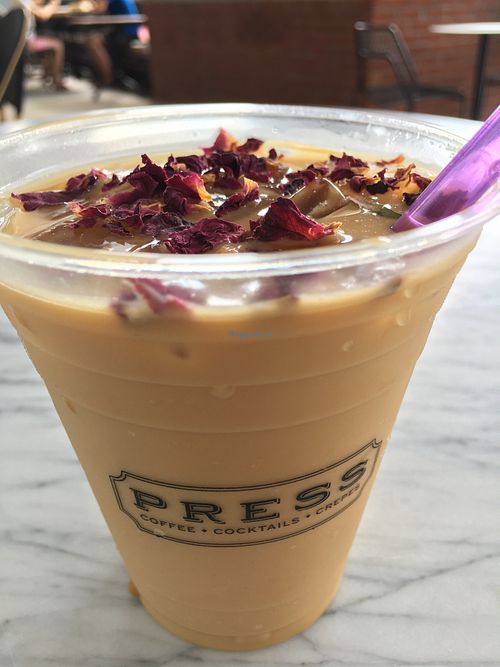Seasonal iced latte w/ oat milk  at PRESS Coffee Crêpes Cocktails in Durham
