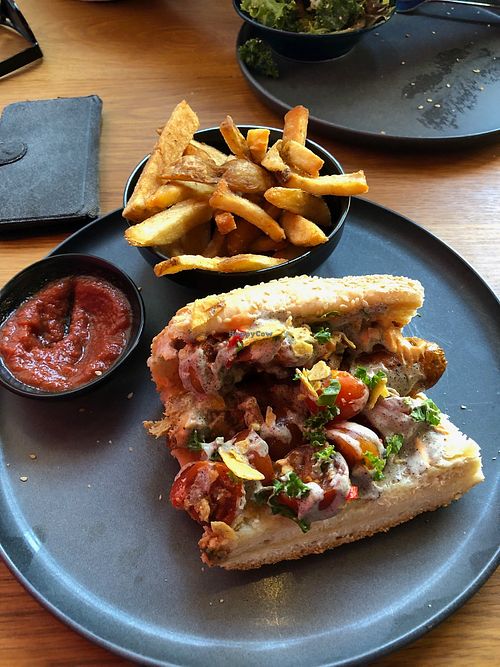 Hail Seitan dog with half side of Fries at Good Dogs Plant Foods in Vancouver