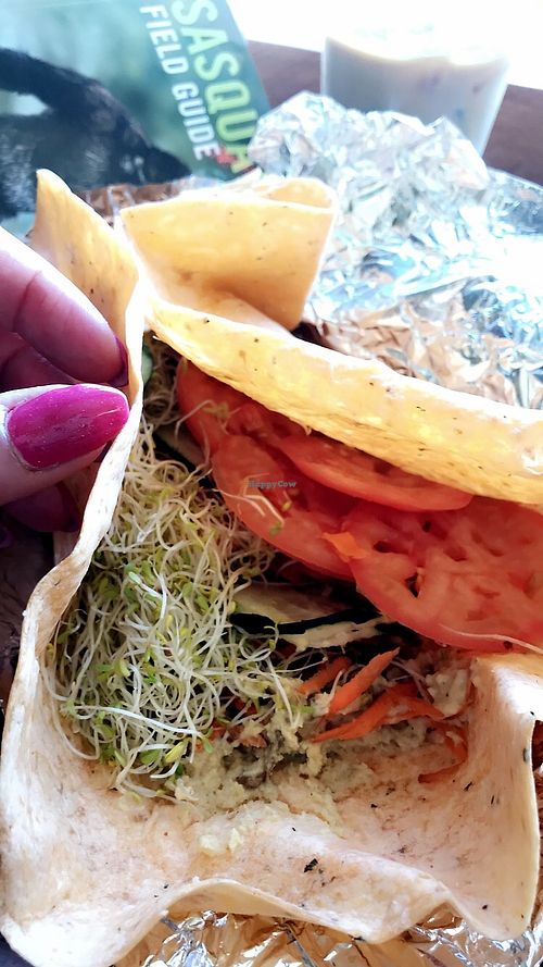 the “Winston” wrap w hummus sunflower seeds tomatoes sprouts (vegan) at Tumbleweeds Bookstore and Cafe in Gardiner