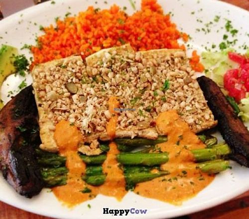 Tofu with pesto sauce, veggies, saffron rice, mushrooms and other yummies! at The Lost and Found Saloon in Miami