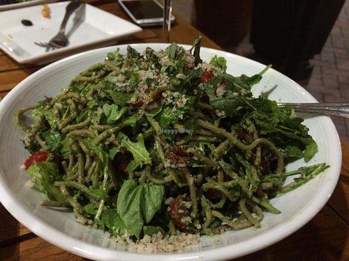 Pesto soba noodles with lots of basil, arugula, sun dried tomatoes, and fresh tomatoes at Christopher's Kitchen in Palm Beach Gardens