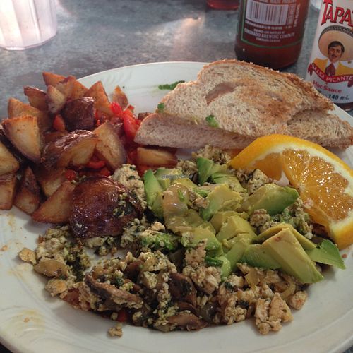 pesto tofu scramble with avocado and home fries! at Downbeat Diner and Lounge in Honolulu