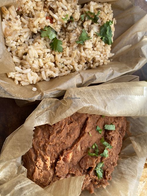 Full side of rice and a full side of beans.  at Nollie's Taco Joint in Carolina Beach