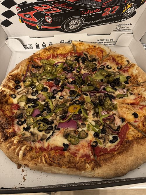 Tony’s pizza with vegan cheese and jalapeños   at Caliente Pizza & Drafthouse in Aspinwall