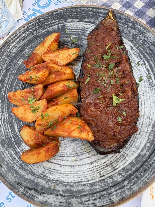 Aubergine with caramelised onions and potatoes 🍆 🥔  at Taverna Sapori Greci in Trieste