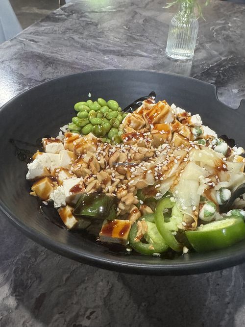 Poke bowl w brown rice, tofu, edamame, wasabi peas, jalapeños and other goodies  at Poke Jon's in Blue Ridge