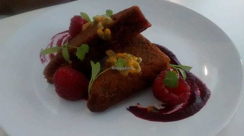 Earl grey cake with beetroot jam, fresh raspberries and passionfruit at 1847 in Manchester