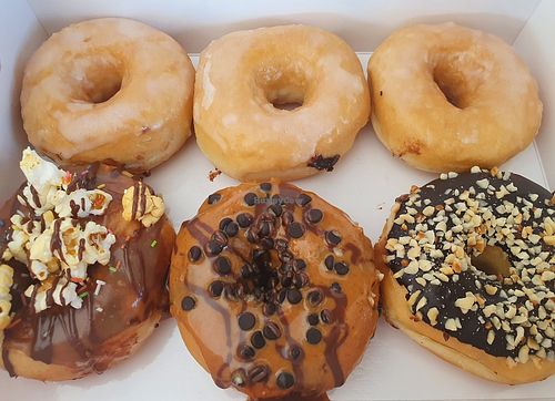 Sugar, caramel and popcorn, peanut butter and choc chips, choco and nuts at Royal Donuts in Innsbruck