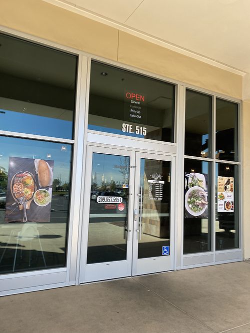 Storefront with operating hours  at The Pho in Modesto