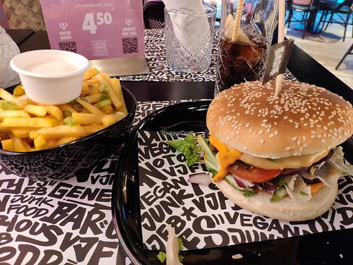 Burger with fries at Vegan Junk Food Bar - Cologne in Cologne