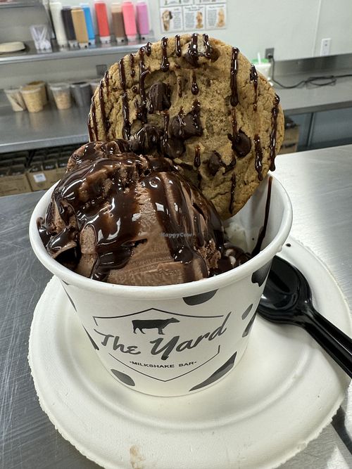 Cup of chocolate & vanilla, cookie, chocolate sauce. All vegan.   at The Yard Milkshake Bar in Gulf Shores