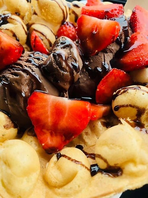 Vegan Bubble Waffle with Vegan chocolate icecream, vegan chocolate sauce and fresh strawberries- glorious! at The Yard in Southwold