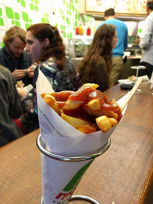 when in Amsterdam.. must try fries! at Maoz - Damrak in Amsterdam