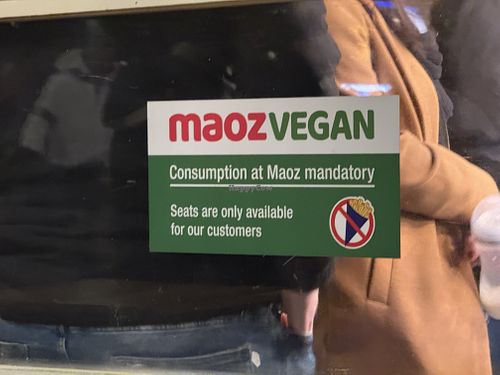 sign #Veganuary at Maoz - Damrak in Amsterdam