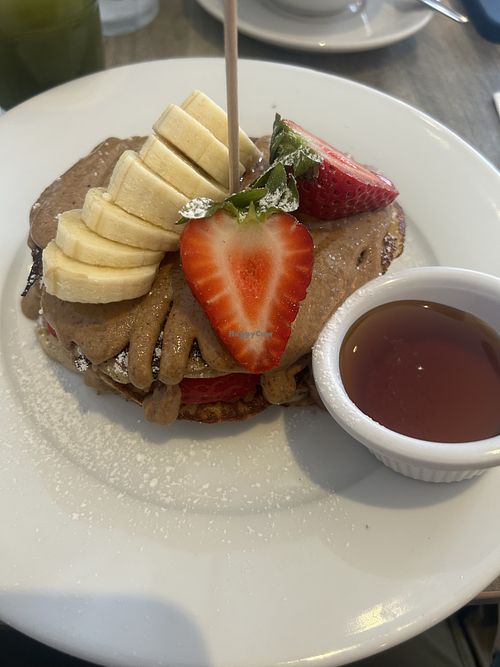Pancakes with almond butter, strawberry, banana and maple syrupp  at Pog  in Malahide