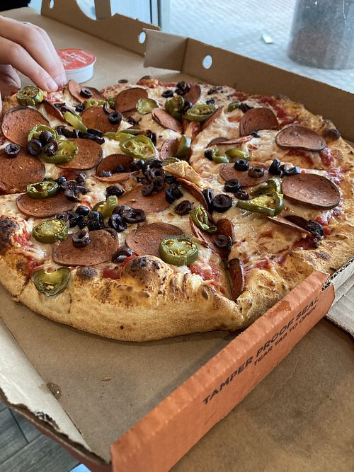 Vegan cheese and vegan pepperoni, olives and Jalapeños   at Pizza Pizza in Toronto