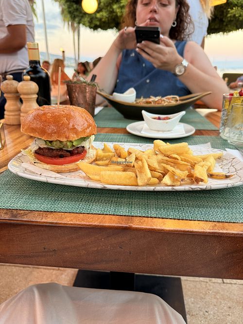 Burger, I added chimichurri to it, and dipped my chips in aioli   at Siso Beach in Mallorca