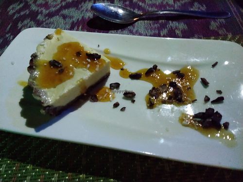 Raw orange tart with chocolate date nut crust and topped with orange compote at Waterfall Villas in Dominical