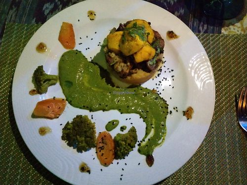 Sweet potatoes baked with pineapple and fresh made almond milk and cinnamon, topped with oven roasted veggies and a sauce made of basil, mint, cilantro, parsley garlic & tamari at Waterfall Villas in Dominical