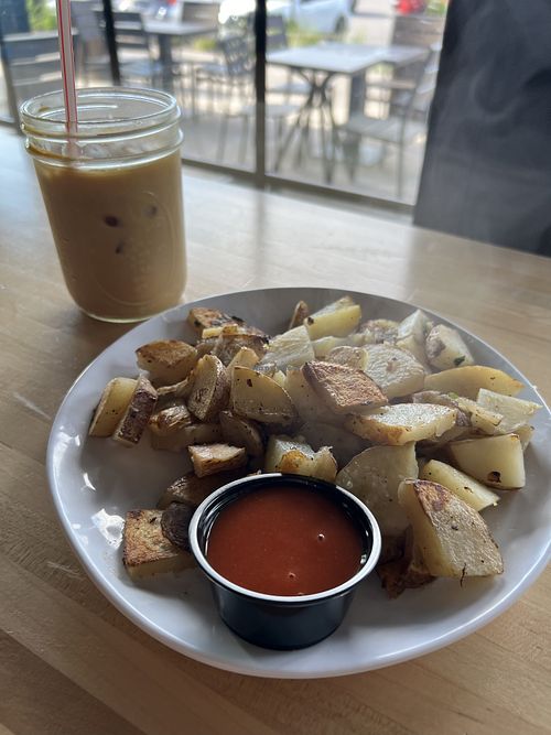 Vegan home fries and an almond milk latte  at FairPour in Fairport