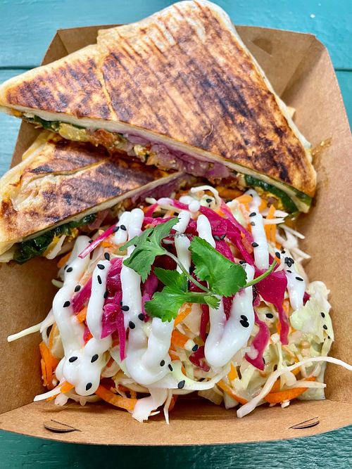 Breakfast burrito with side slaw at Cavendish Cafe in Brighton