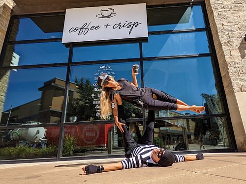 A copper and a cat burglar caffeinating at coffee + crisp.  Has seasonal events like a costume contest in October. at Coffee + Crisp in Austin