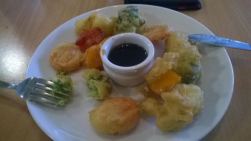 Cheesecake with coconut vanilla ice cream at New Plymouth Loving Hut at Three Pillars Cafe in New Plymouth