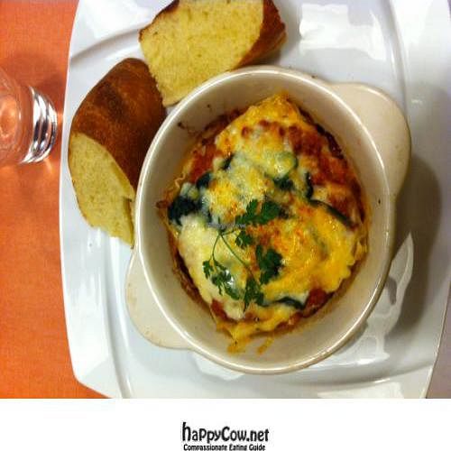 The lasagna includes soymeatin the sauce and focaccia bread on the side. at Sofa Vegetarian Cafe in Tokyo