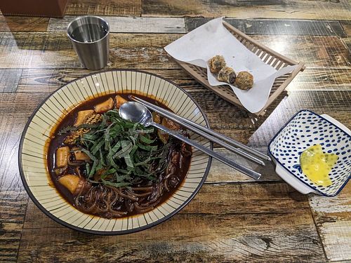 Vegan jajang noodles tteobokki (with pumpkin (squash) added) and (1 order of) glass noodles in seaweed at Cow Tteokbokki  in Seoul