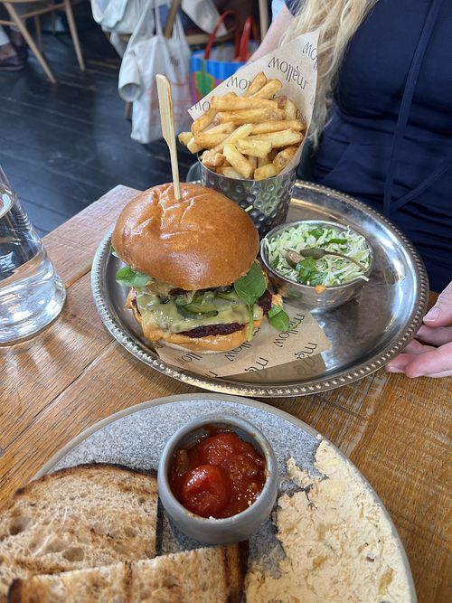 beetroot tempeh smash burger, onion rings, cherry tomato relish, guajillo chilli mayonnaise, slaw, fries  at Mallow - Borough Market in South East London