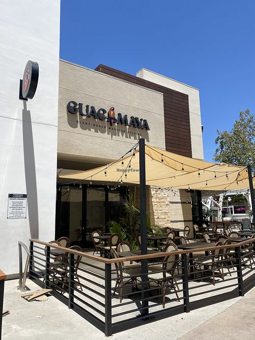 Outdoor Signage w/Patio  at Guacamaya Oasis Plant Based Mexican Cuisine in Downey