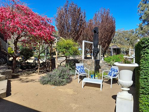 Outdoor garden seating at Wild Grounds Cafe in Morgan Park