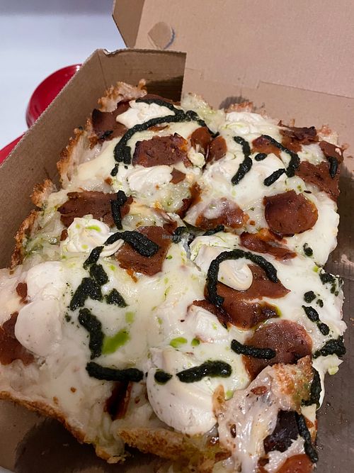 Detroit style vegan pizza with pepperoni, ricotta, pesto  at TNT Pizza in San Diego
