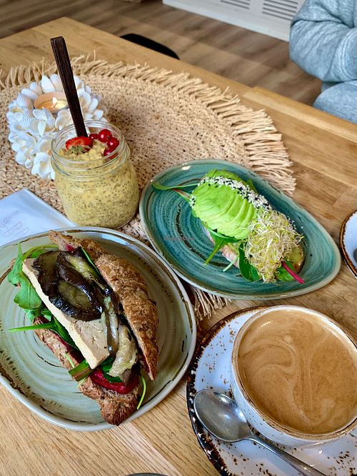 Vegan croissant, avocado sandwich, chia pudding, oat cappucino.  at BOHO in Helsinki