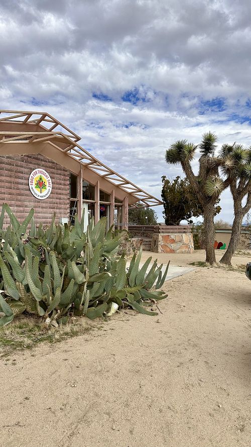 Drive up view. Main entrance is around the left side    at Food for Thought Cafe in Joshua Tree