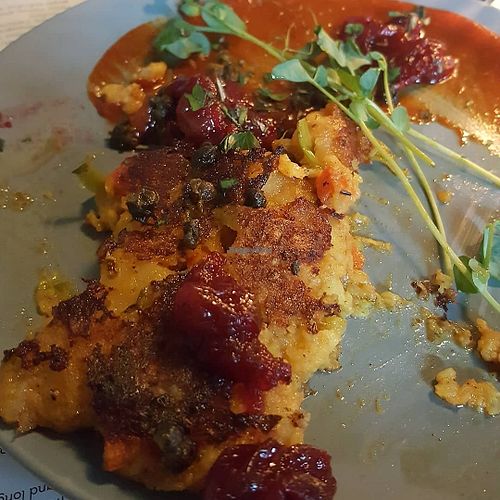 Samosa cakes: samosa inspired potato + vegetable cakes, grilled. served with cranberry + orange chutney, spiced ketchup, fried shallots, pea shoots at Ollie in Ypsilanti