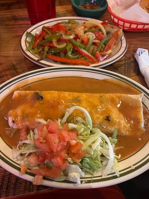 Whole pinto (not refried) burrito, smothered with vegetarian green chili, no cheese, no dairy, and added fajita veggies (told this could be on the side only). at D'Corazon Mexican Restaurant in Denver