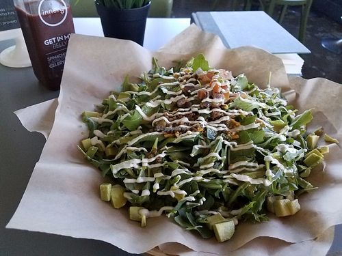 Notyo Salad with raw sunflower chorizo and cashew cream. Get In my Belly fresh juice. at Green Seed Vegan in Houston