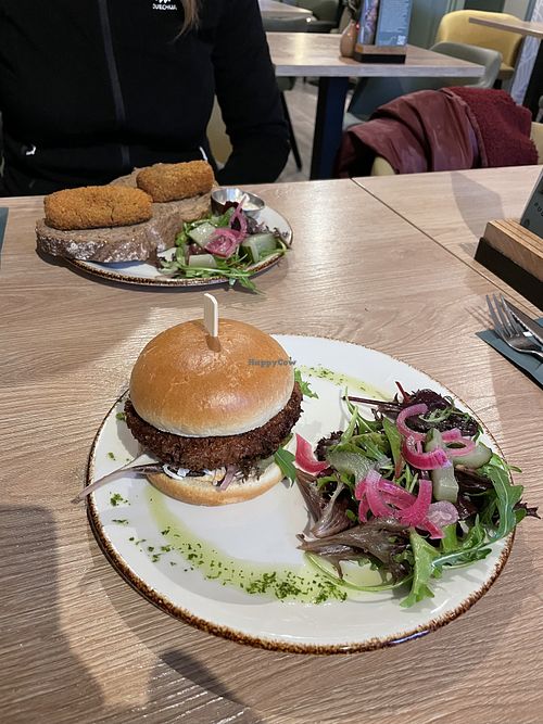 Kimchi burger and vegan kroketten in the background  at Brownies & downieS in Valkenswaard