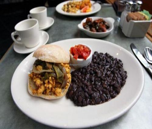 vegan breakfast torta: scrambled tofu on a warm ciabatta roll with roasted poblano strips and grilled red onions. at Cafe Flora in Seattle